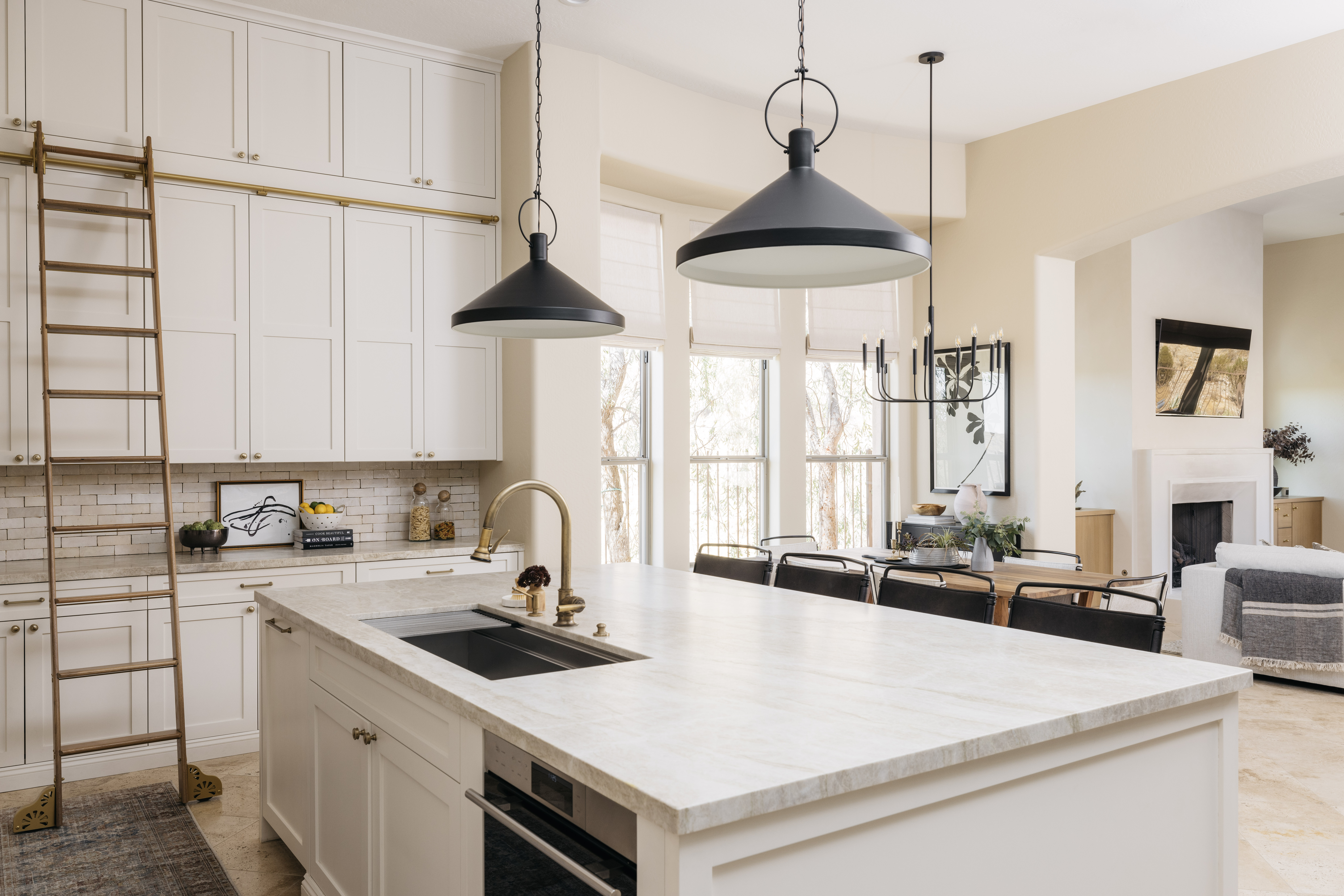 Kitchen island with pendants and living room beyond, The Considered Home